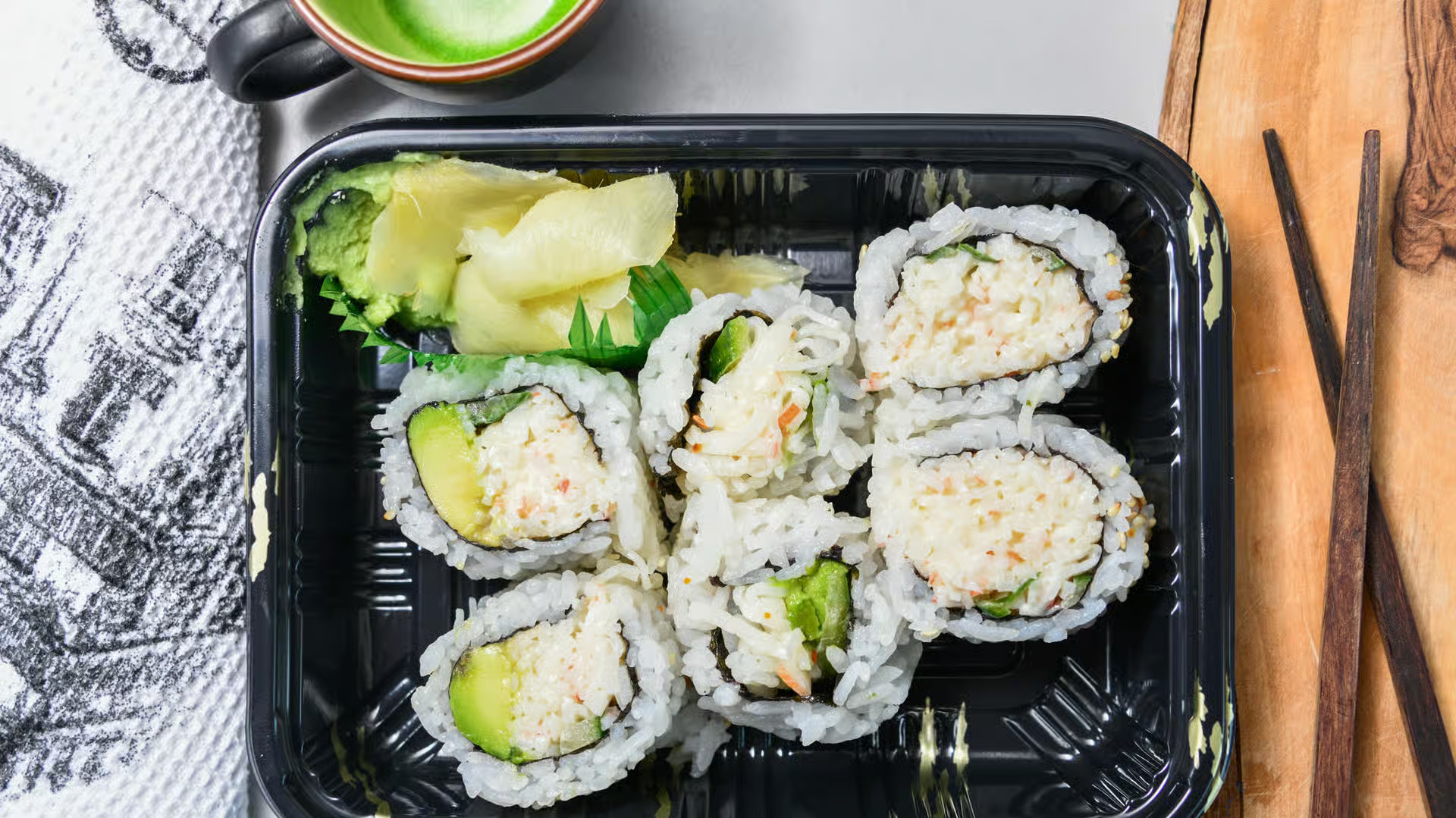 California Roll - Fresh crab, avocado, and cucumber wrapped in seasoned sushi rice and nori
